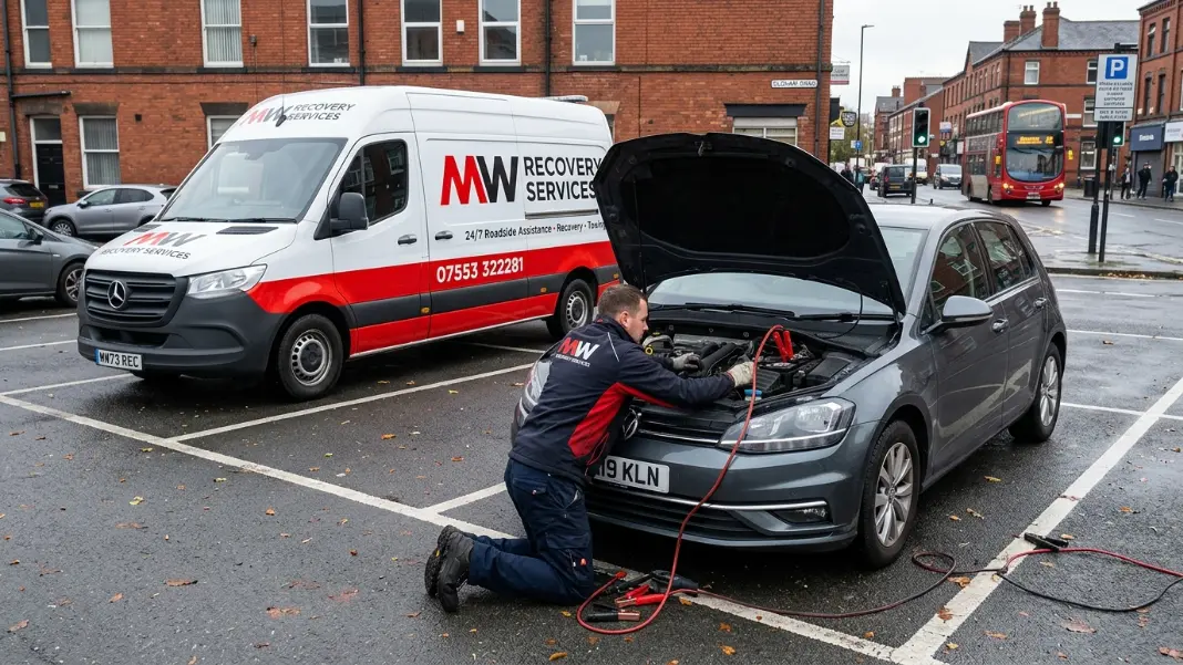 MW Recovery technician connecting jump leads to a car in a Greater Manchester car park