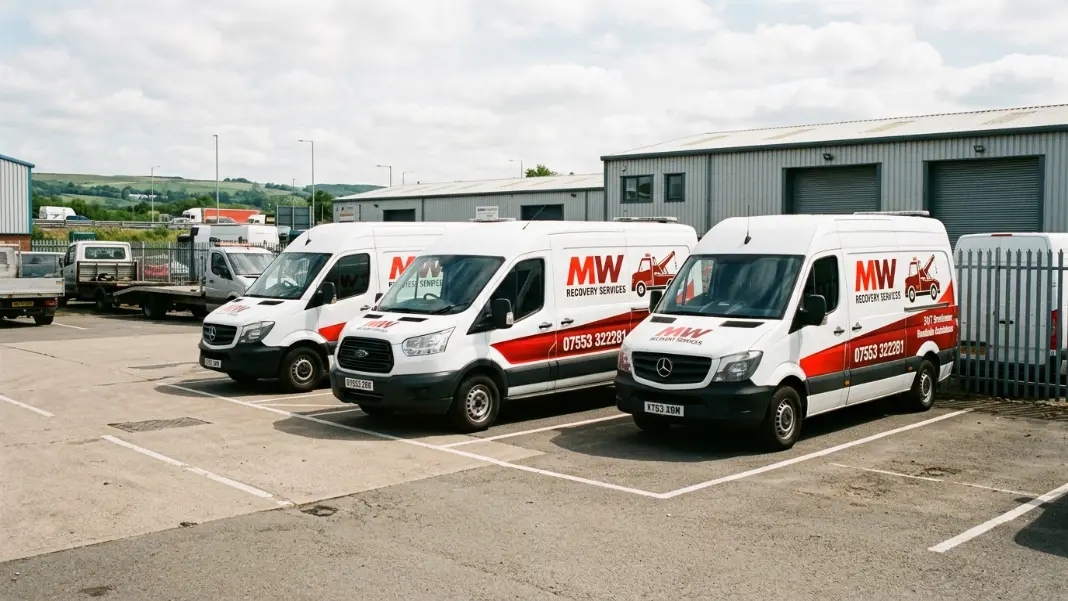 Fleet of commercial vans parked at a Greater Manchester business depot